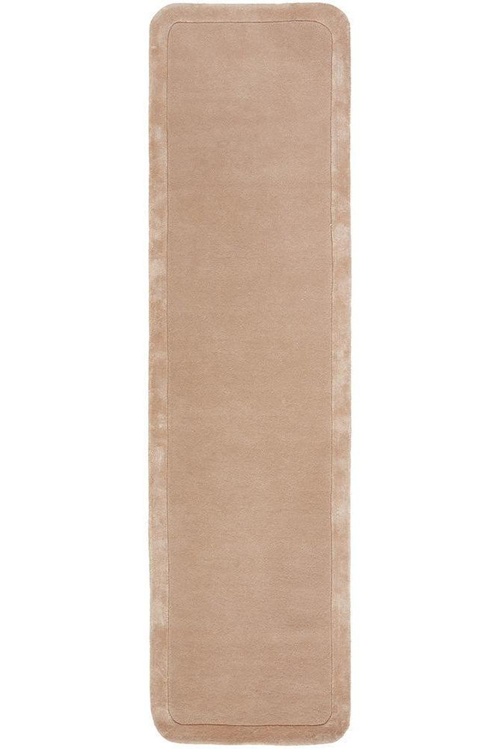 Beige bath mat on a white background