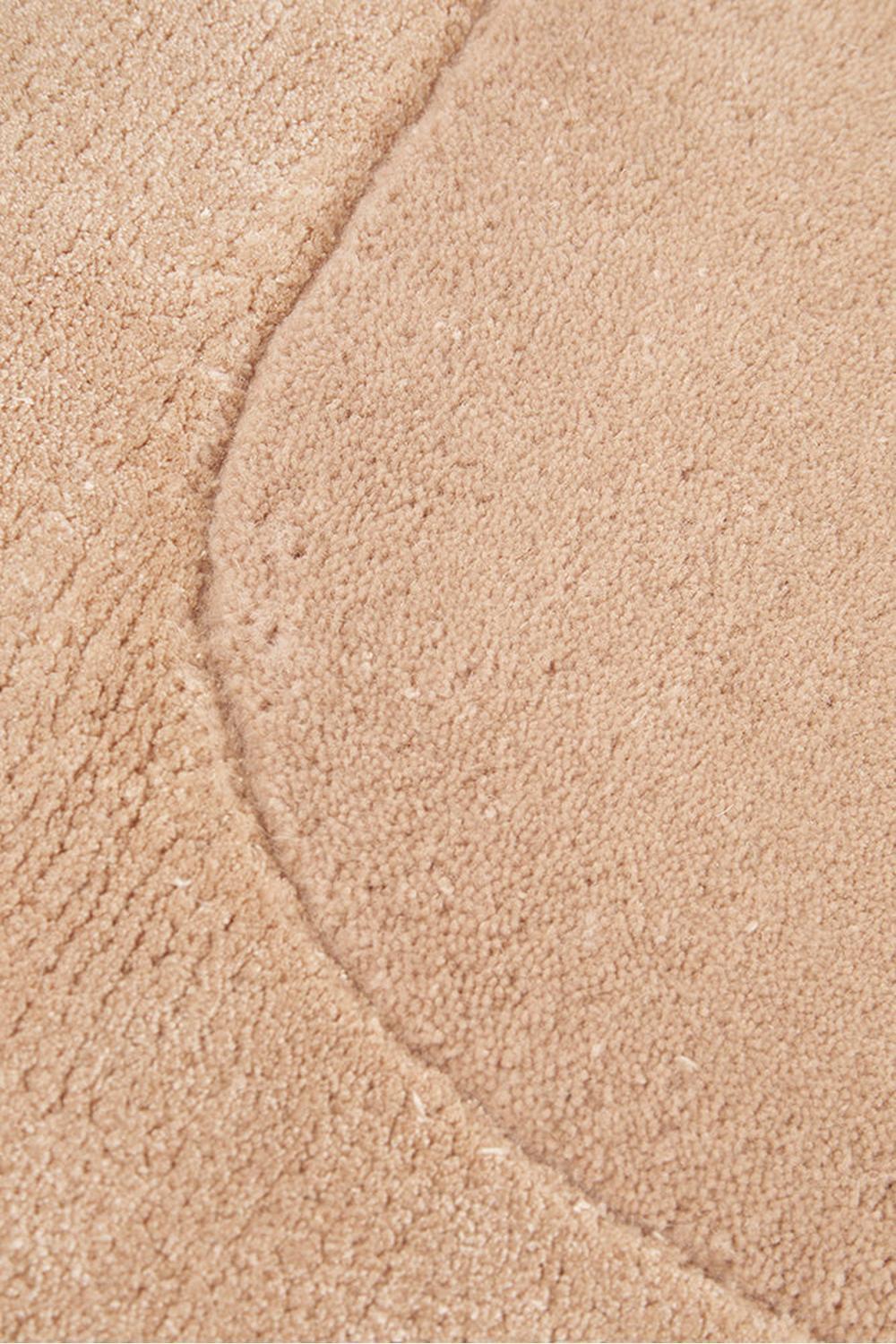 Hugo Nude Runner Rug featuring solid shag texture in warm beige/tan on light beige background, hand-tufted wool