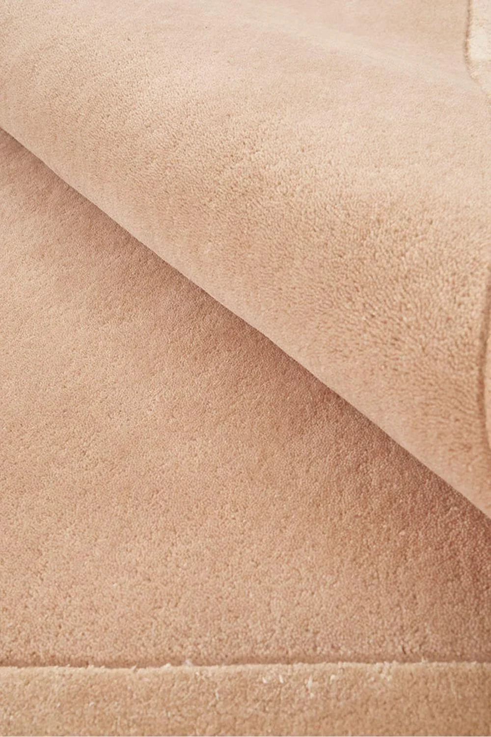 Hugo Nude Runner Rug featuring solid textured pattern in nude, beige and taupe on warm beige background, hand-tufted wool