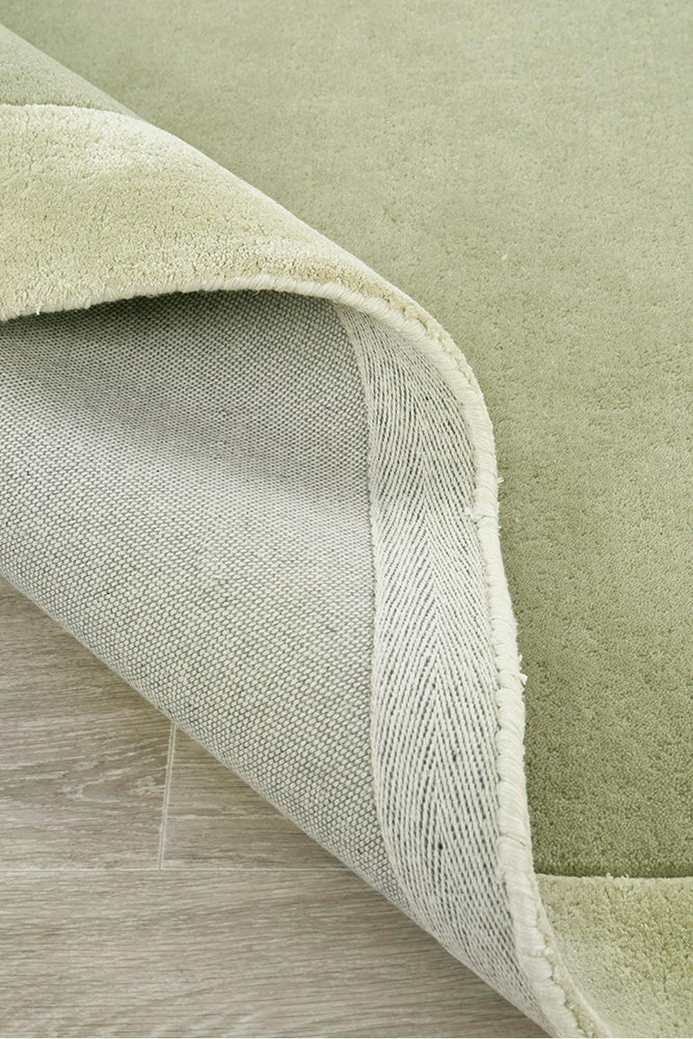 Hugo Sage Runner Rug featuring solid sage green textured weave on light beige background, hand-tufted wool