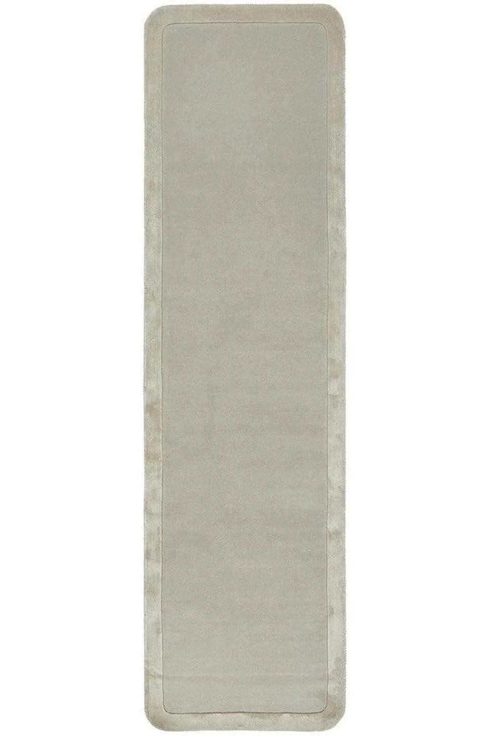 Hugo Silver Rug featuring minimalist solid design in silver-grey with soft border on pale silver background, hand-tufted wool