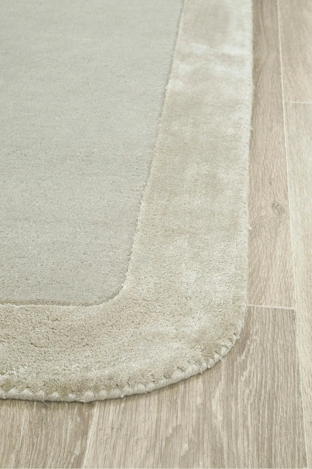 Hugo Silver Runner Rug featuring minimal solid-tone design in silver-grey and ivory on beige background, machine-made wool blend