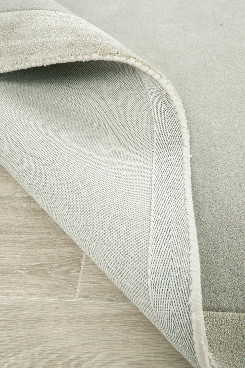 Hugo Silver Runner Rug featuring soft textured weave in silver-grey on light grey background, hand-loomed rug