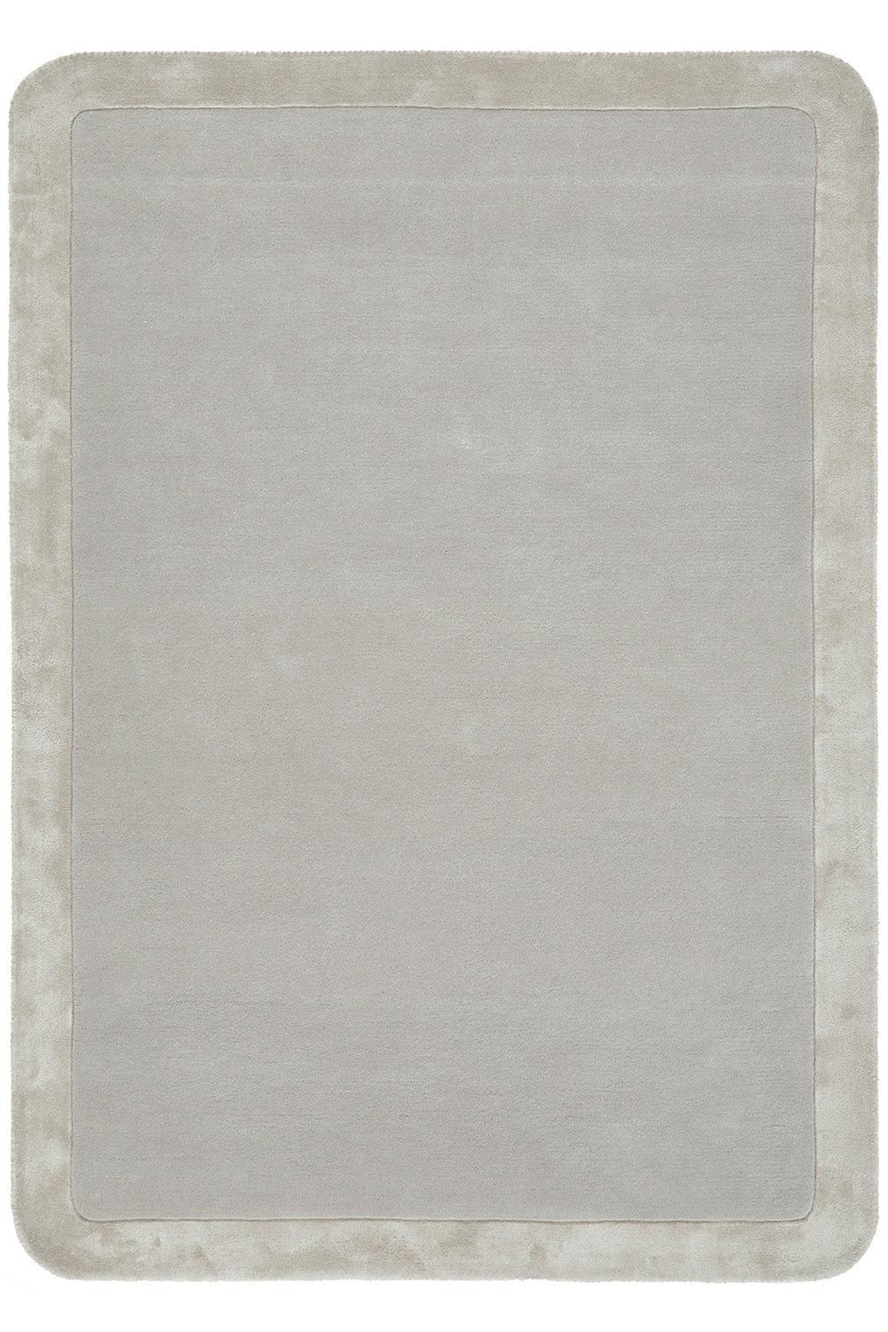 Rectangular rug with a textured border on a plain background