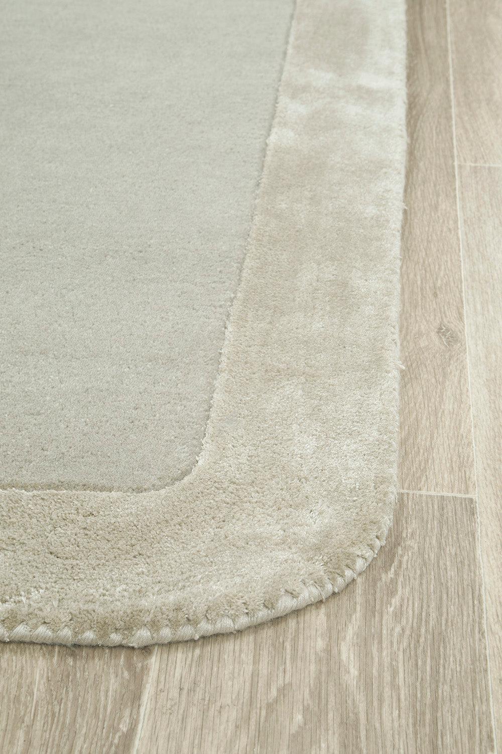 Hugo Silver Rug featuring solid minimalist design in cream, beige and light taupe on light background, machine-made polyester