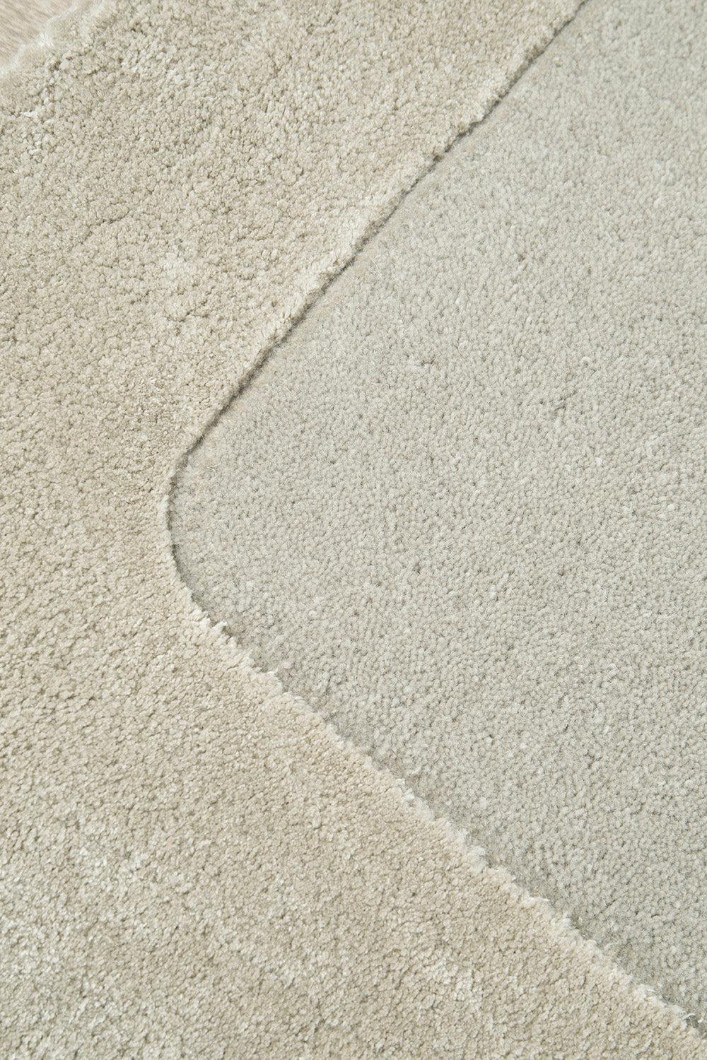 Hugo Rug featuring diagonal color-block pattern in champagne beige, ivory and pale grey on light ivory, hand-tufted wool
