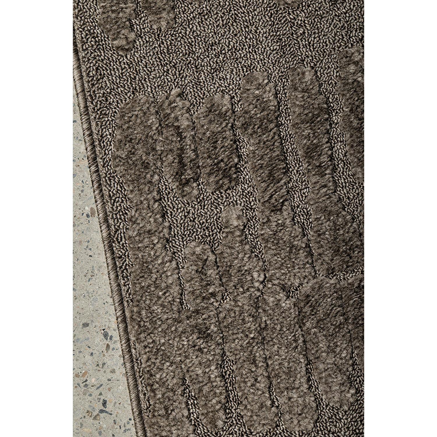 Haven Aliya Mocha Rug featuring textured vertical stripe pattern in mocha brown, taupe and tan on warm brown background, machine-woven wool blend