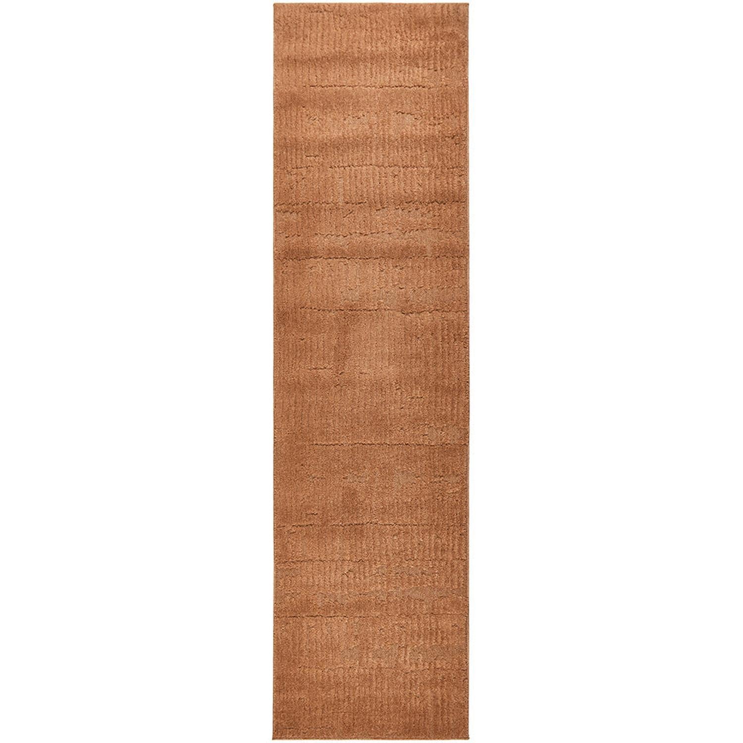 Brown textured rug on a white background