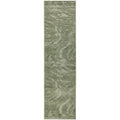 Green runner rug with wavy pattern on a white background