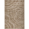 Patterned rug with wavy design in brown and beige tones
