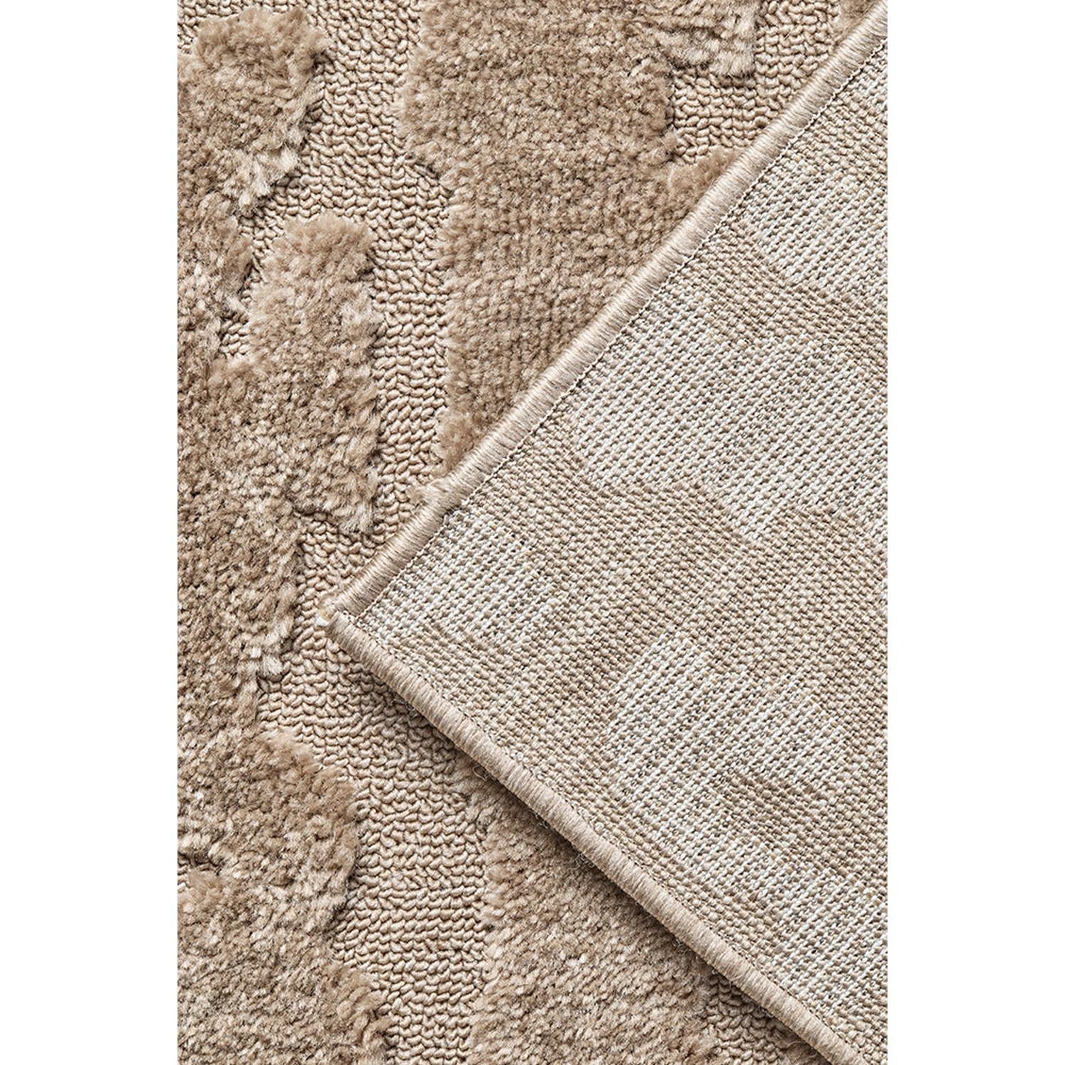 Close-up of textured beige rug with a border