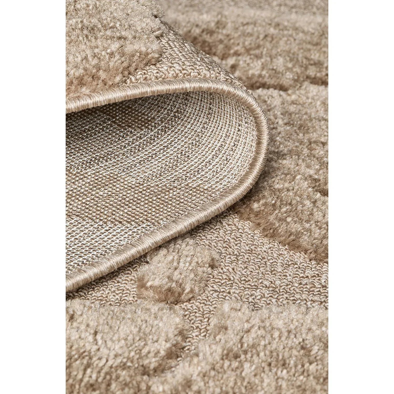 Close-up of a textured beige carpet