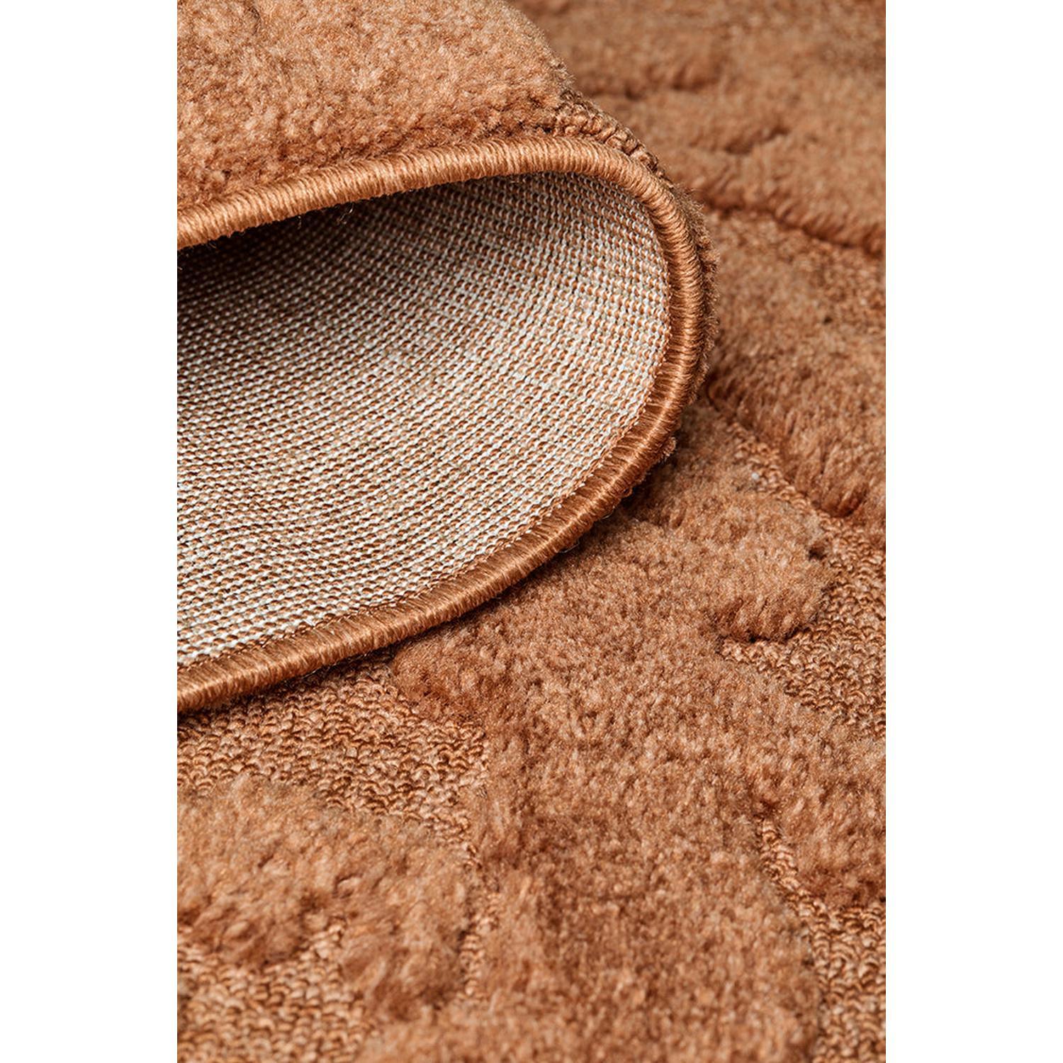 Haven Nyla Rust Runner Rug featuring plush textured surface in rust, copper and cream on light beige backing, machine-made pile