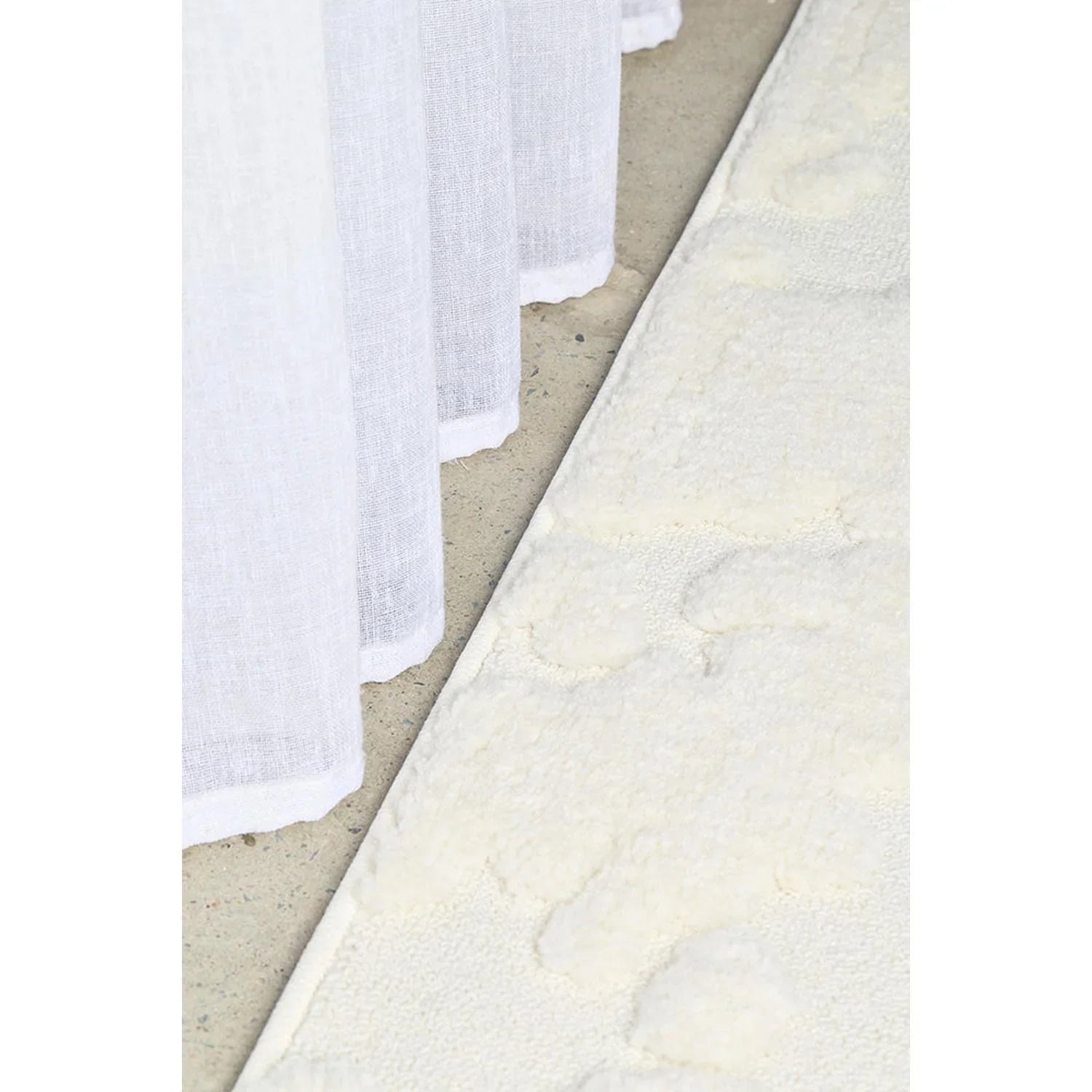 Haven Nyla White Rug featuring subtle damask pattern in ivory, cream and taupe on pale beige background, machine-woven cotton