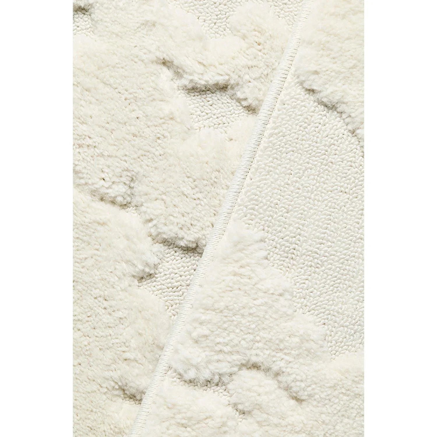 Haven Nyla White Rug featuring plush shag pattern in ivory on white background, hand-tufted wool