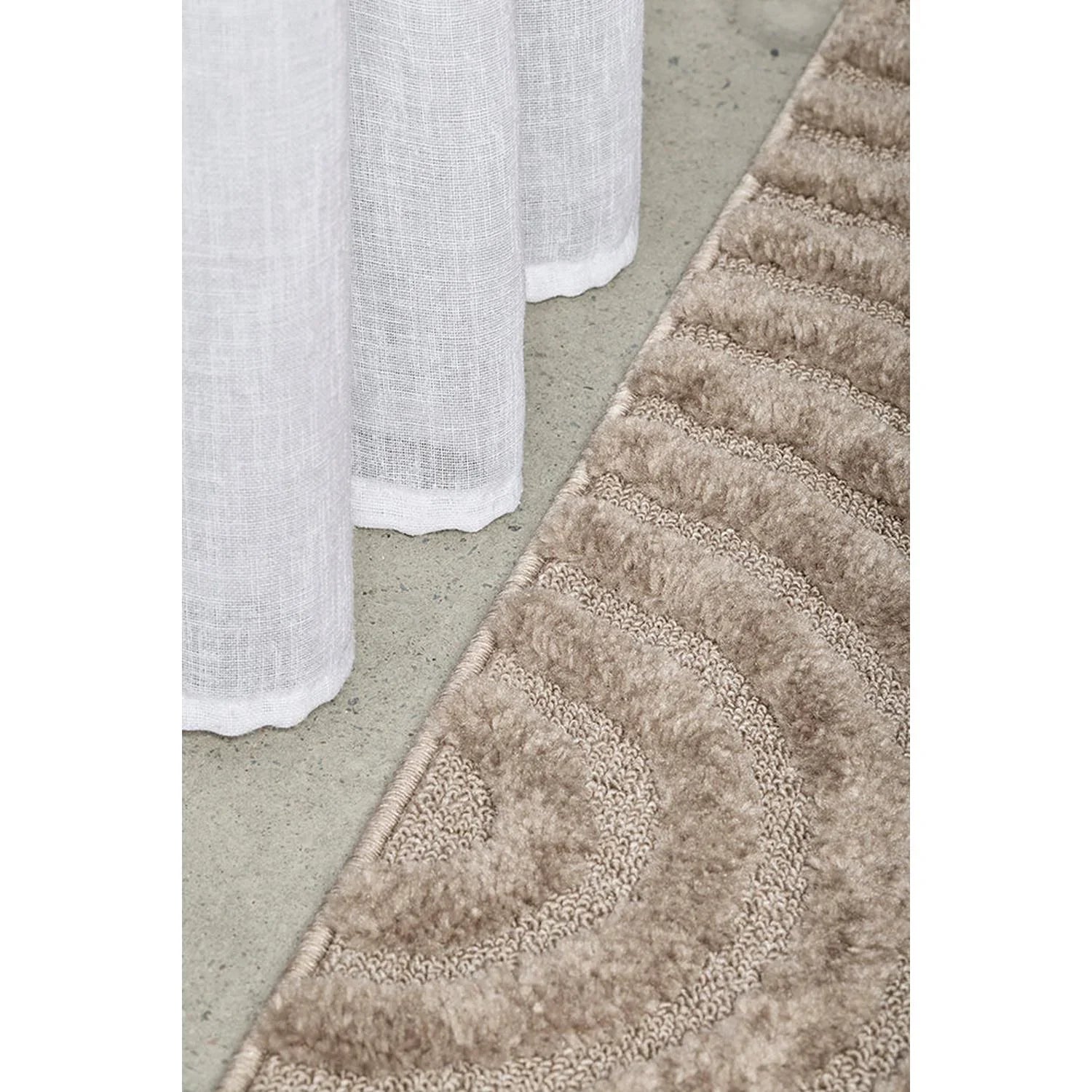 Haven Zina Latte Runner Rug featuring circular pattern in latte, beige and taupe on cream background, machine-made wool blend