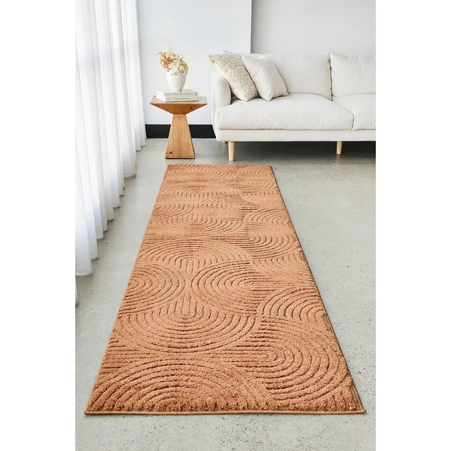 Haven Zina Rust Rug featuring circular swirl pattern in copper, rust and terracotta on warm rust background, hand-tufted wool
