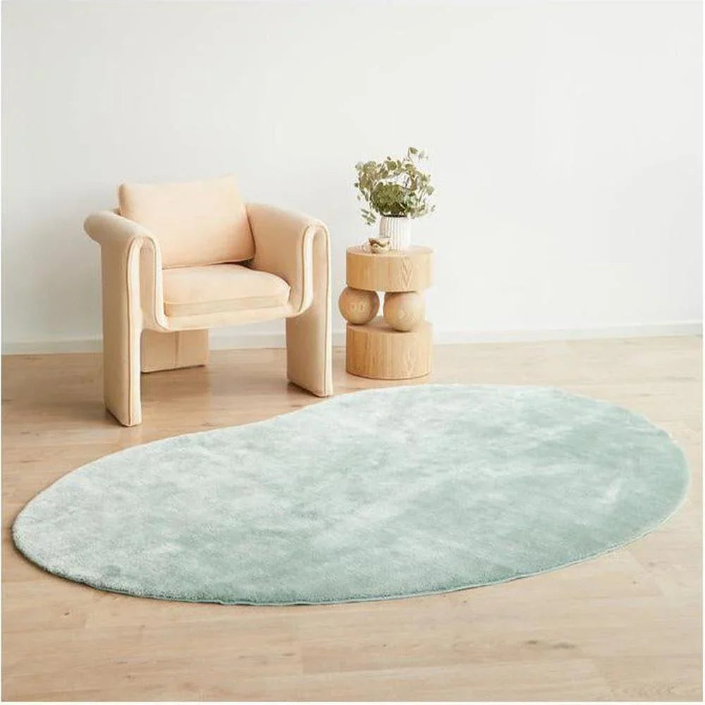 Jelly Bean Mint Green Rug featuring solid pattern in mint green on light cream room background, machine-made polyester