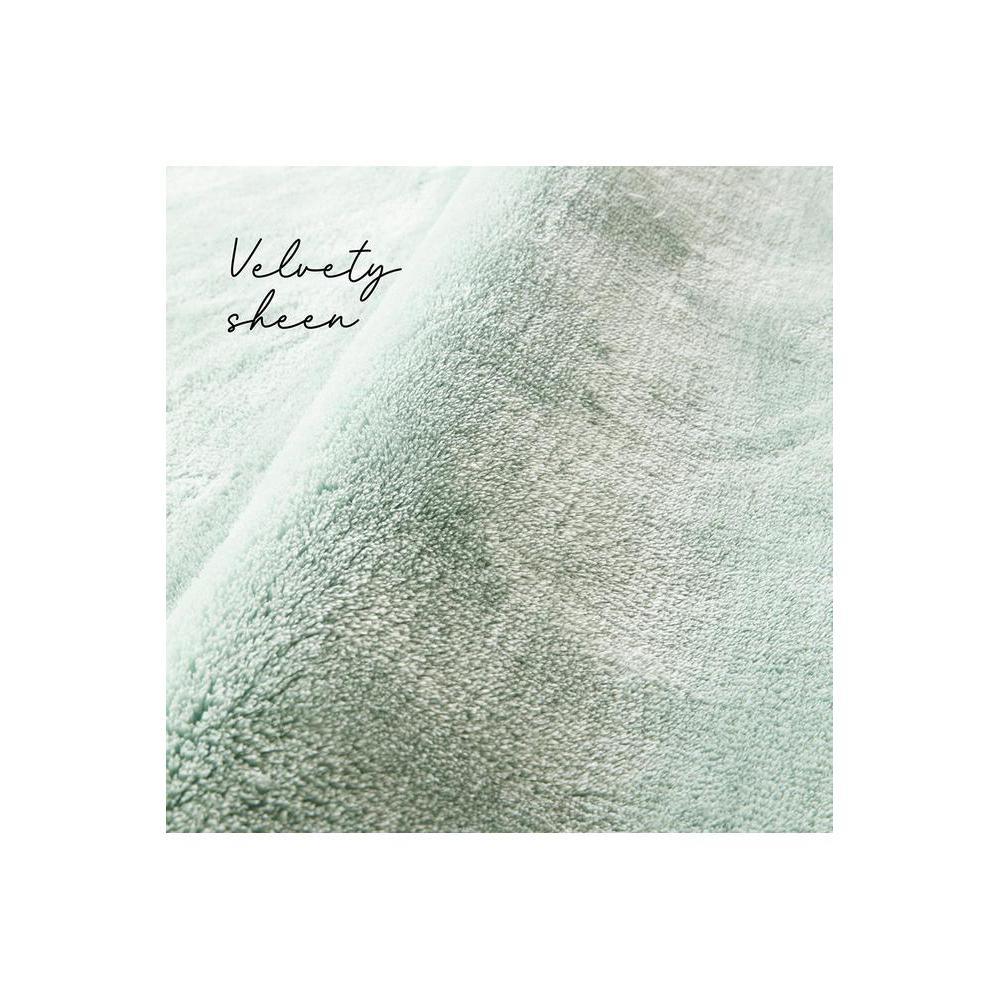 Jelly Bean Mint Green Rug featuring solid plush texture in mint green on white background, machine-made rug