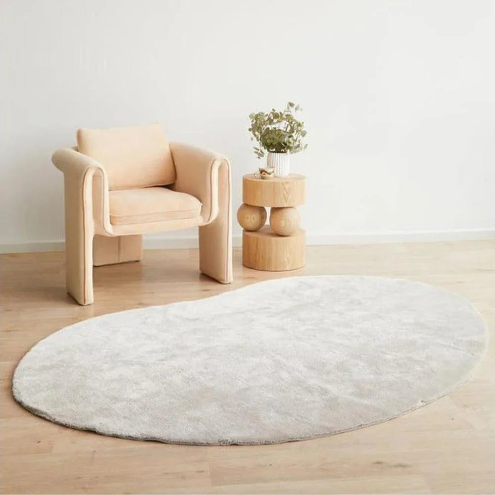 Jelly Bean Pearl Rug featuring solid round design in pearl grey on white-cream background, machine-made polyester