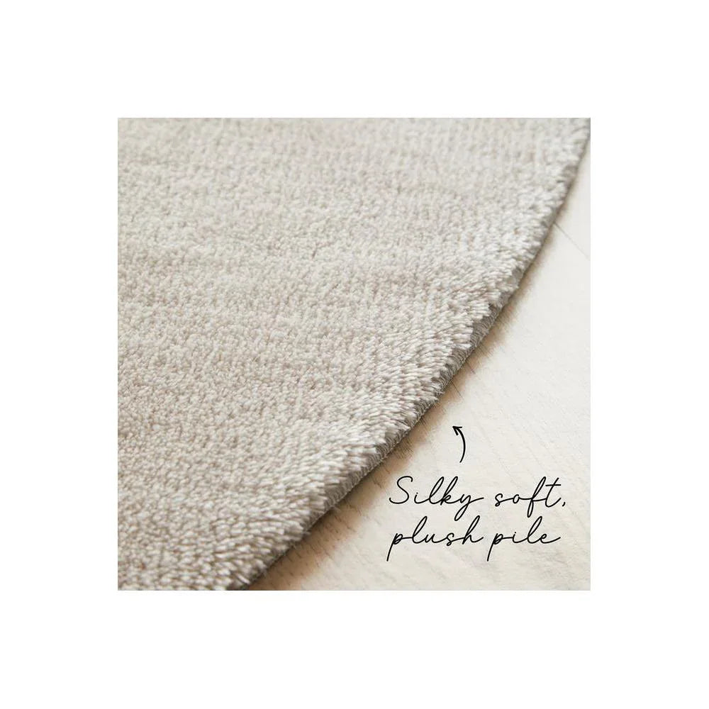 Jelly Bean Pearl Rug featuring solid plush pile in pearl beige on light floor, hand-tufted wool
