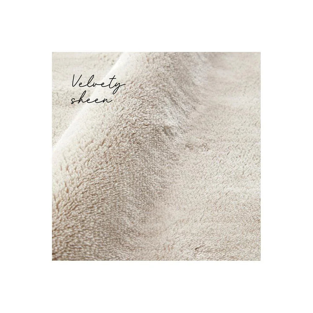 Jelly Bean Pearl Rug featuring velvety texture in cream, ivory and beige on white background, plush wool
