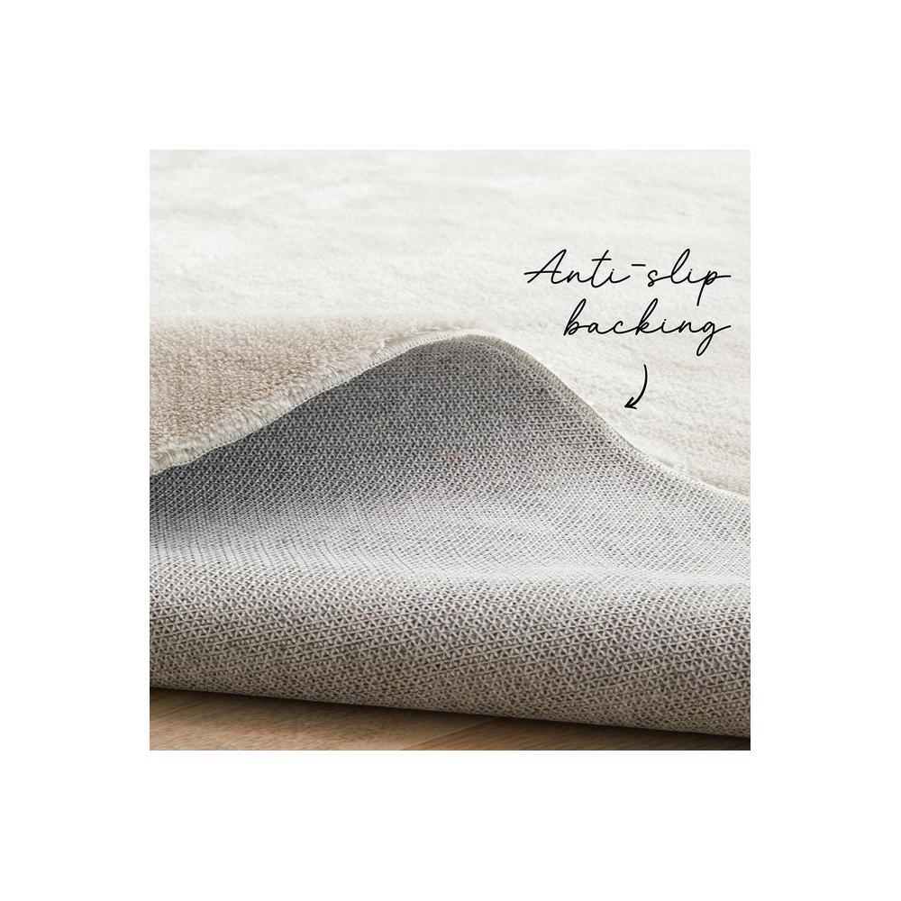 Jelly Bean Pearl Rug featuring subtle geometric weave with anti-slip backing in ivory, taupe and grey on cream background, woven polyester
