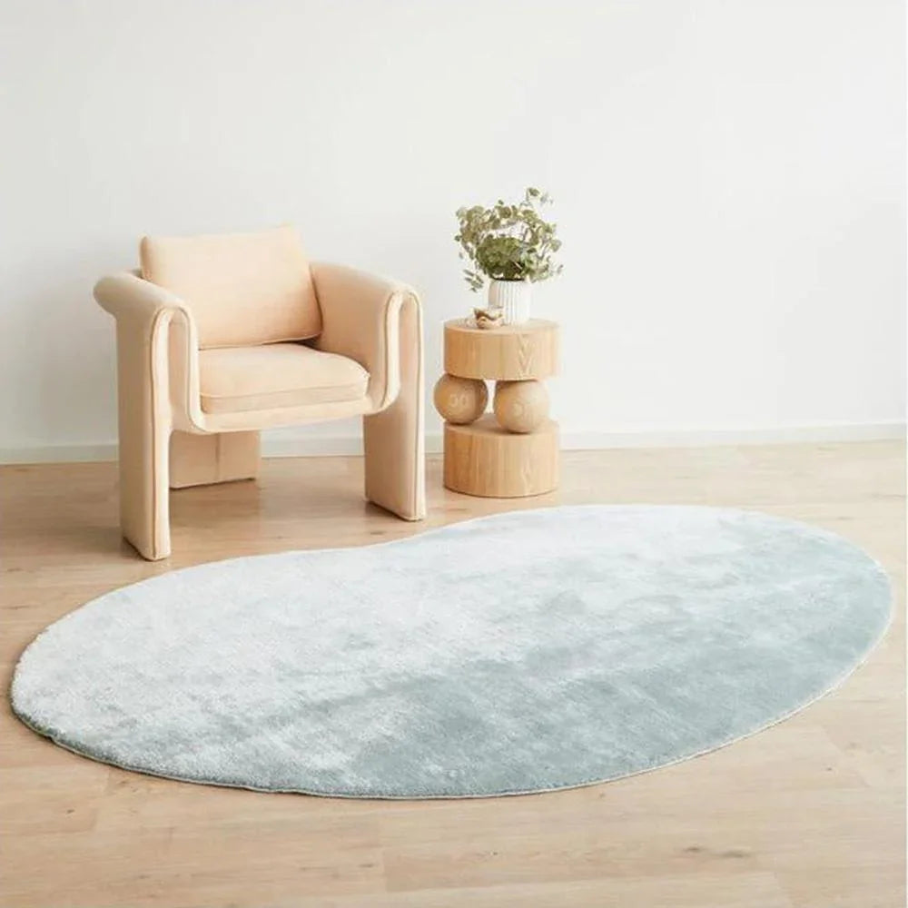 Jelly Bean Powder Blue Rug featuring solid shaggy round design in powder blue on light timber floor, hand-tufted wool