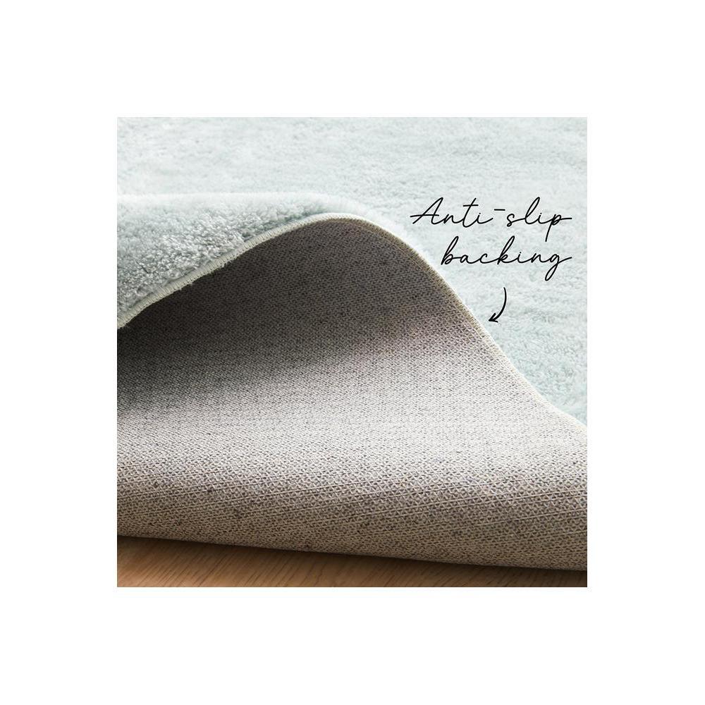 Jelly Bean Powder Blue Rug featuring woven texture with anti-slip backing in powder blue, ivory and taupe on pale blue background, machine-made rug