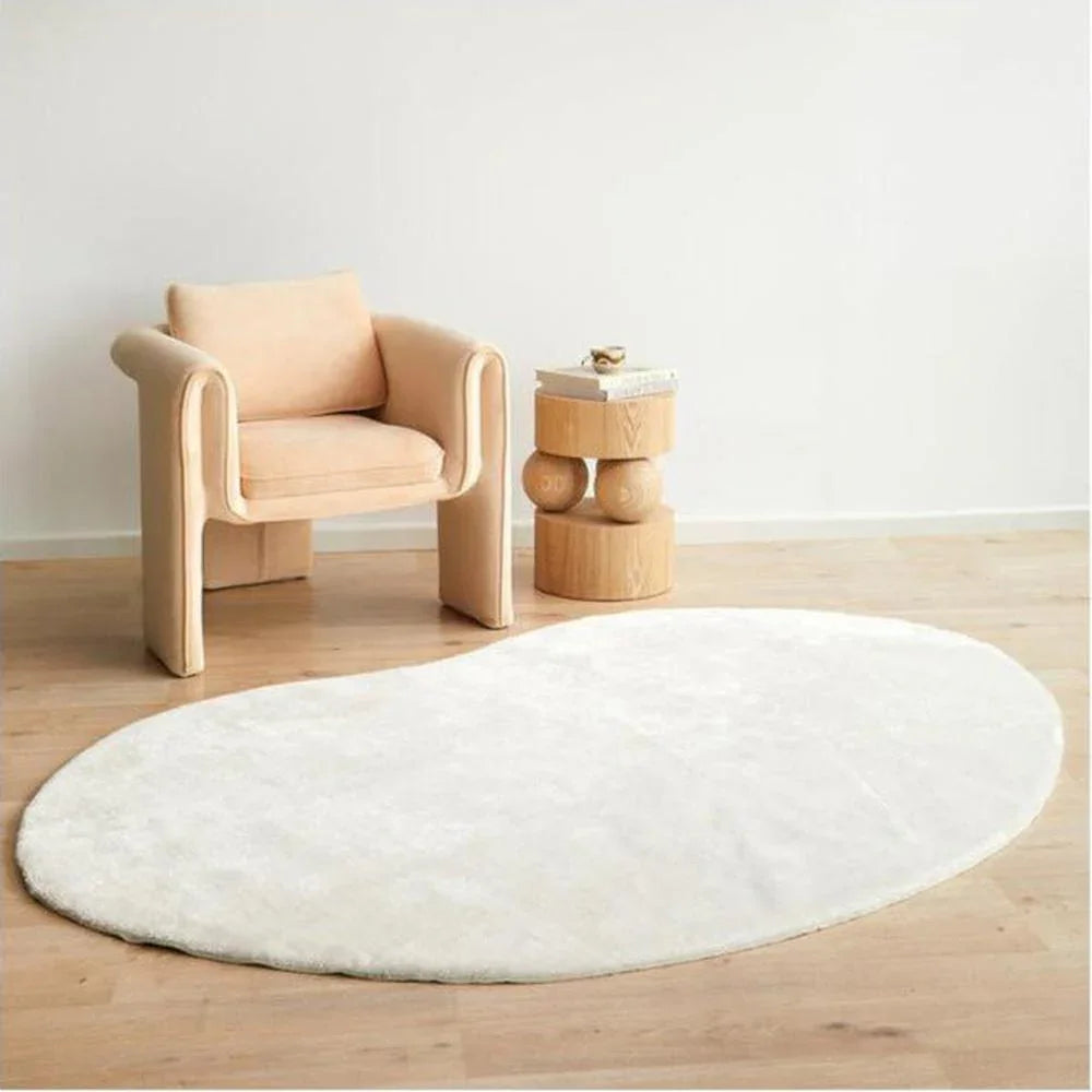 Jelly Bean Snow White Rug featuring solid white oval design on pale cream background, hand-tufted wool