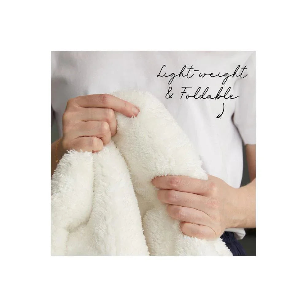Jelly Bean Snow White Rug featuring fluffy plush texture in white on light background, lightweight and foldable by Rug Culture