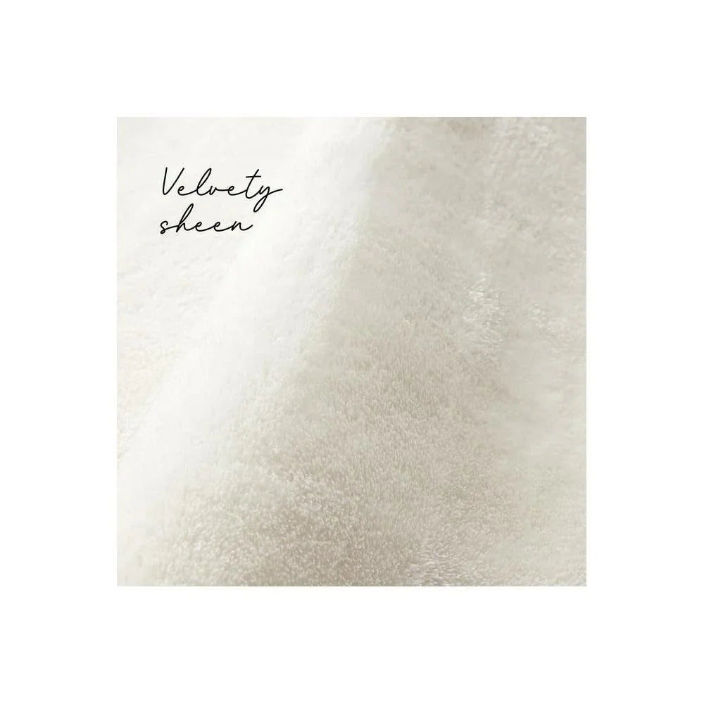 Jelly Bean Snow White Rug featuring velvety plush texture in ivory and cream on white background, hand-tufted wool