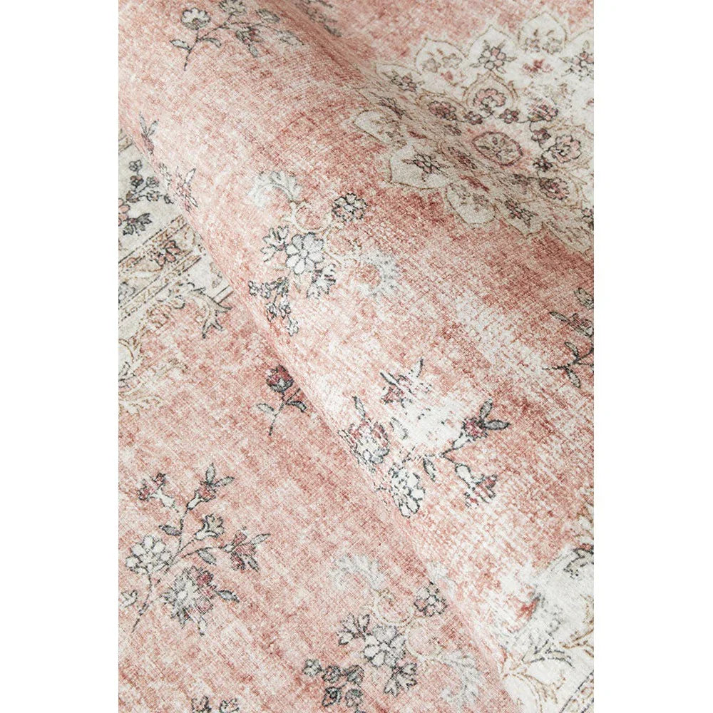 Kindred Coco Peach Runner featuring distressed floral pattern in peach, ivory and dusty pink on cream background, hand-tufted wool