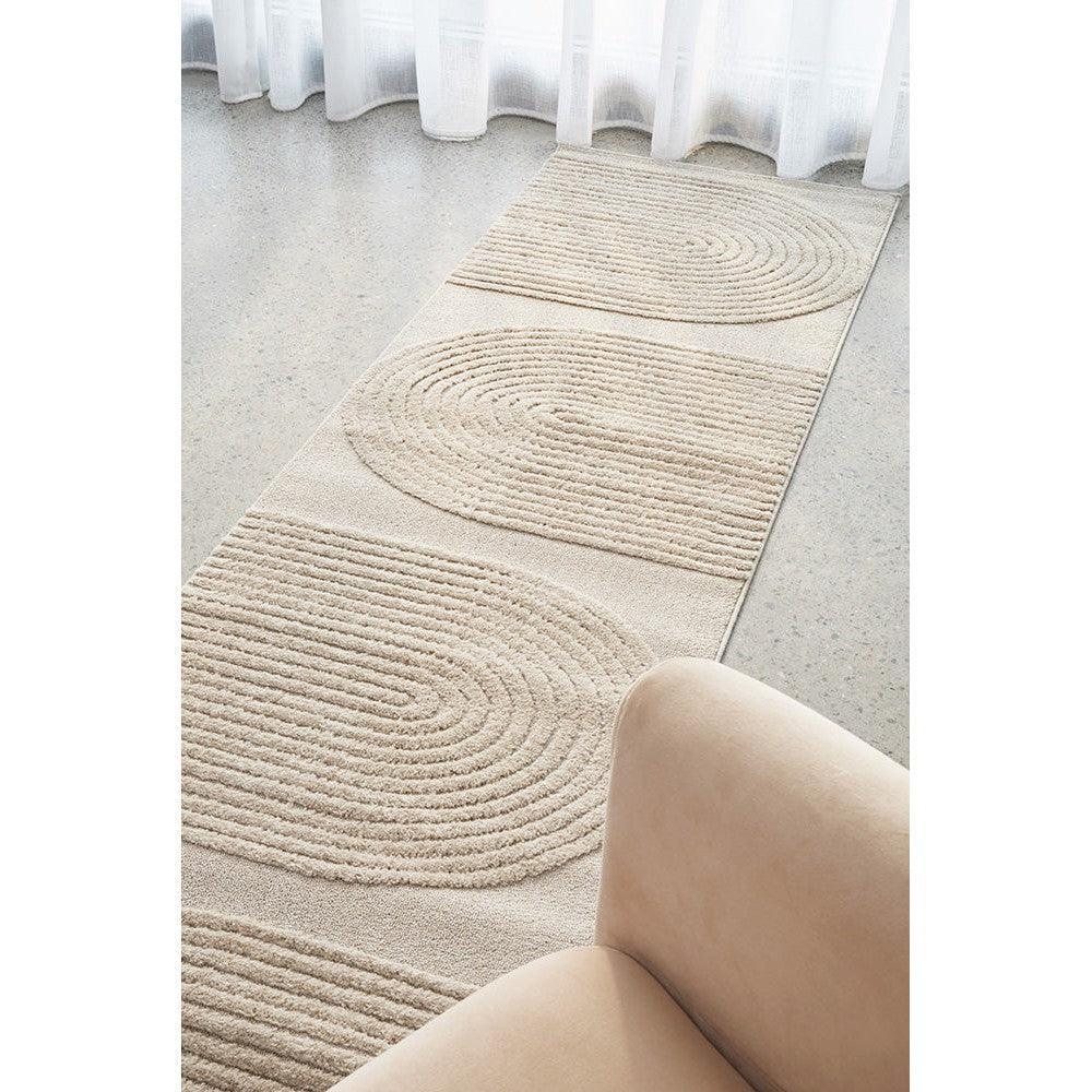 Lotus Abbey Beige Runner Rug featuring circular ripple pattern in beige and cream on light beige background, hand-tufted polyester