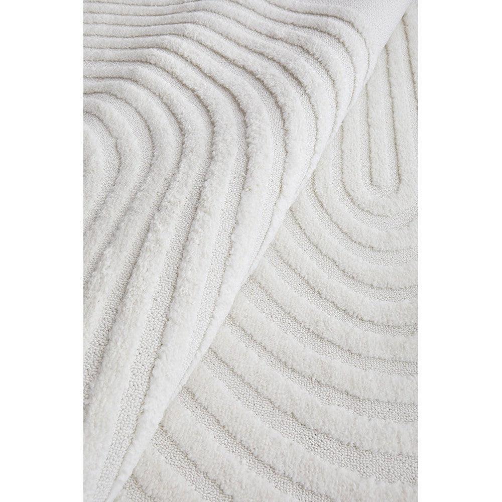 Lotus Abbey White Rug featuring ripple concentric pattern in white on ivory, hand-tufted wool