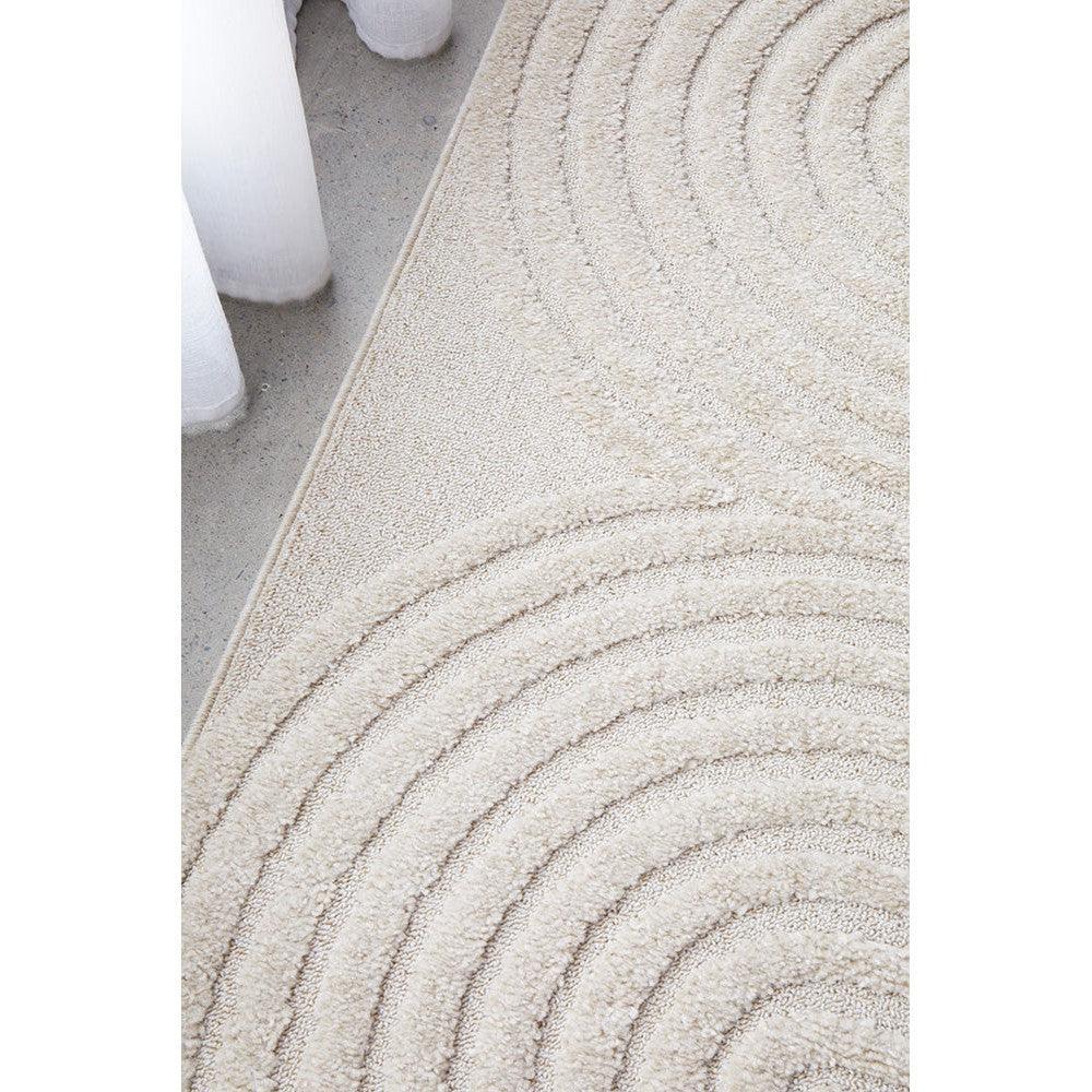 Lotus Carl Beige Rug featuring concentric circular pattern in cream, beige on light beige base, hand-tufted wool