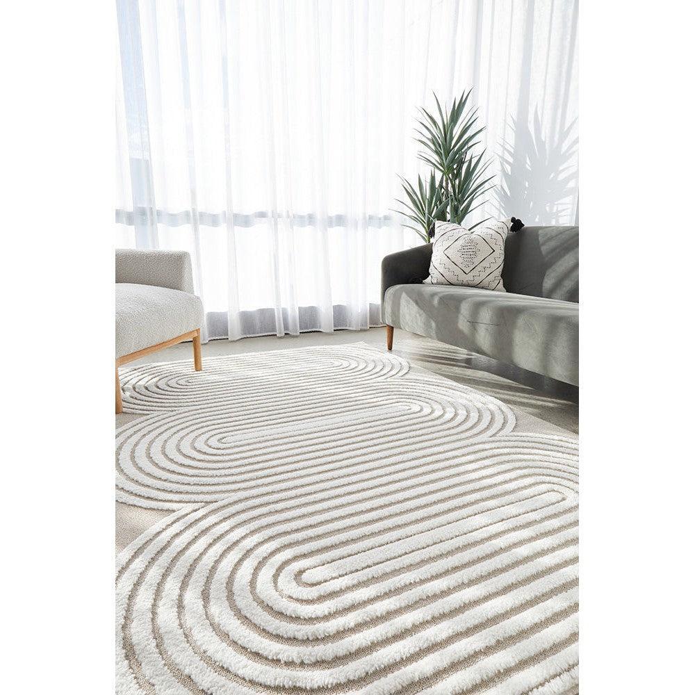 Lotus Carl Mixed Rug featuring concentric swirl pattern in cream, beige, taupe on ivory background, hand-tufted wool