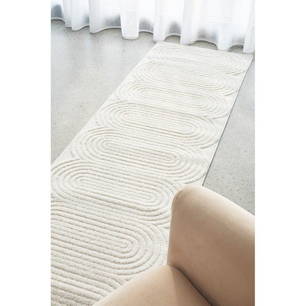 Lotus Carl White Runner Rug featuring circular swirl pattern in ivory on white background, machine-made rug (Rug Culture)