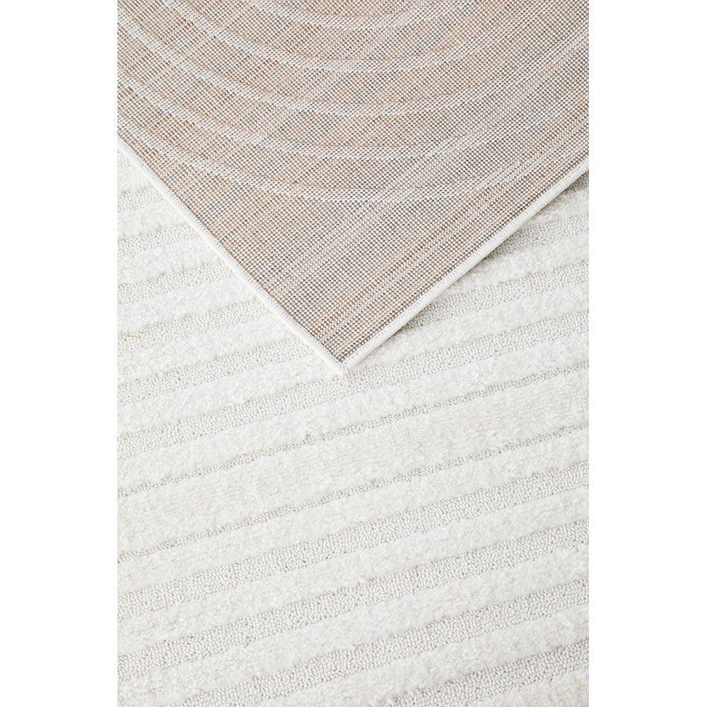 Lotus Carl White Rug featuring circular pattern in dusty rose and cream on ivory background, machine-made wool