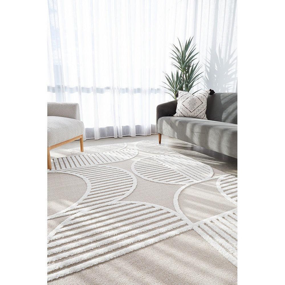 Lotus Leo Mixed Rug featuring circular geometric pattern in cream, white and beige on light beige, machine-made polyester