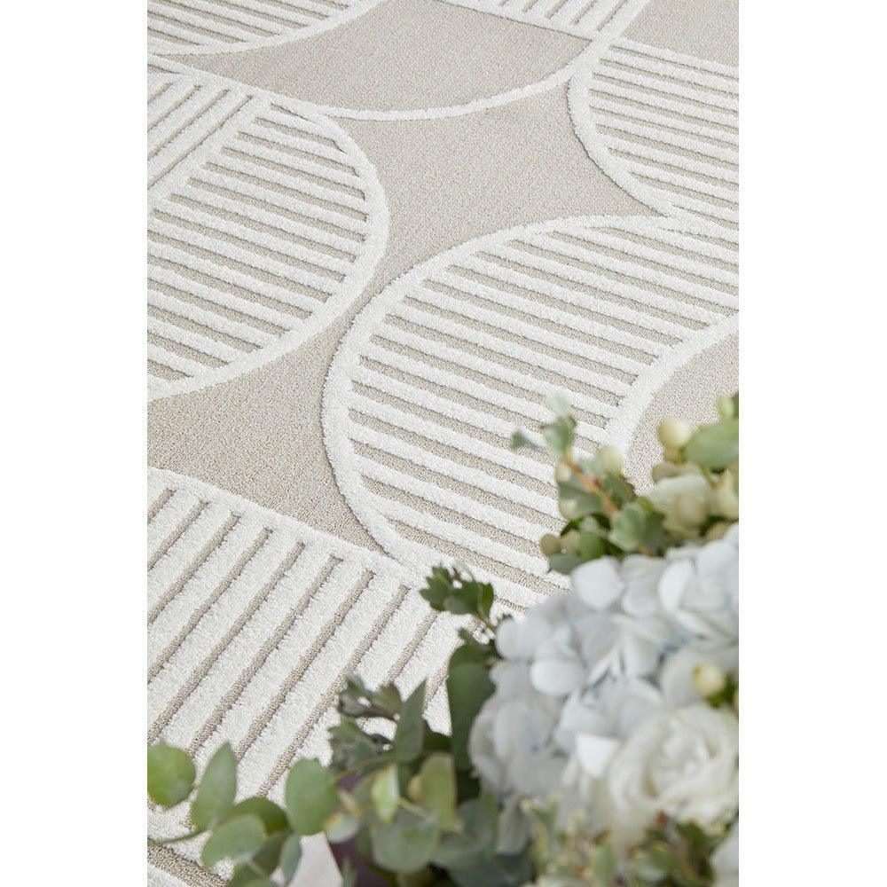 Lotus Leo Mixed Rug featuring circular striped pattern in cream, ivory and beige on light beige background, hand-tufted wool