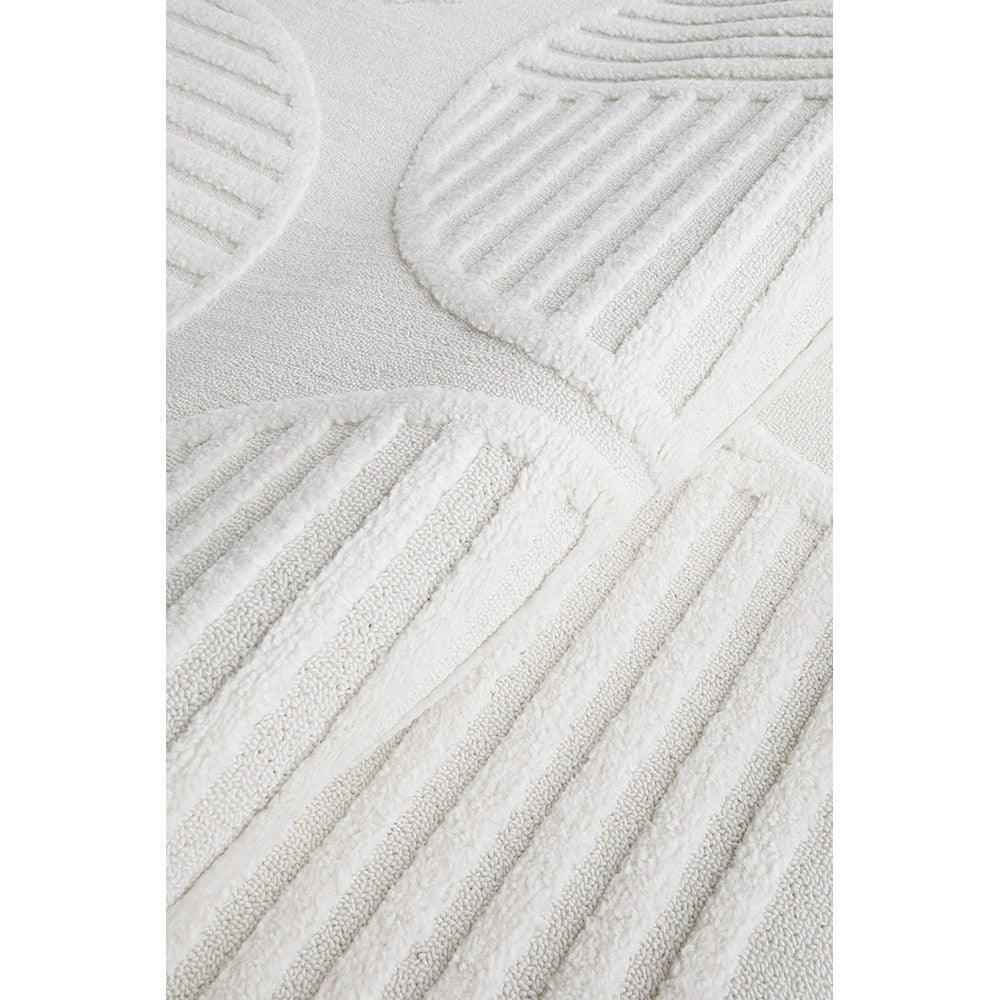 Lotus Leo White Rug featuring circular striped geometric pattern in ivory and cream on white background, machine-woven wool