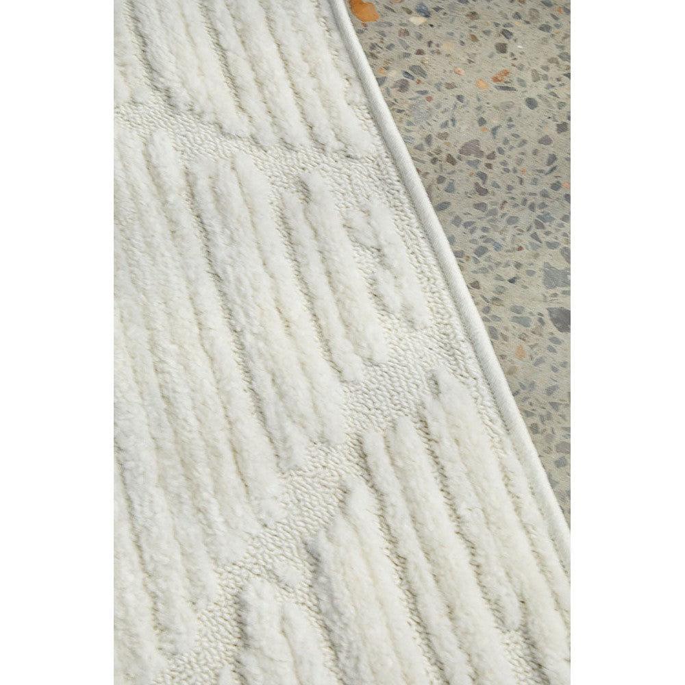 Marigold Aria White Rug featuring textured ribbed pattern in ivory/cream on white background, hand-tufted wool