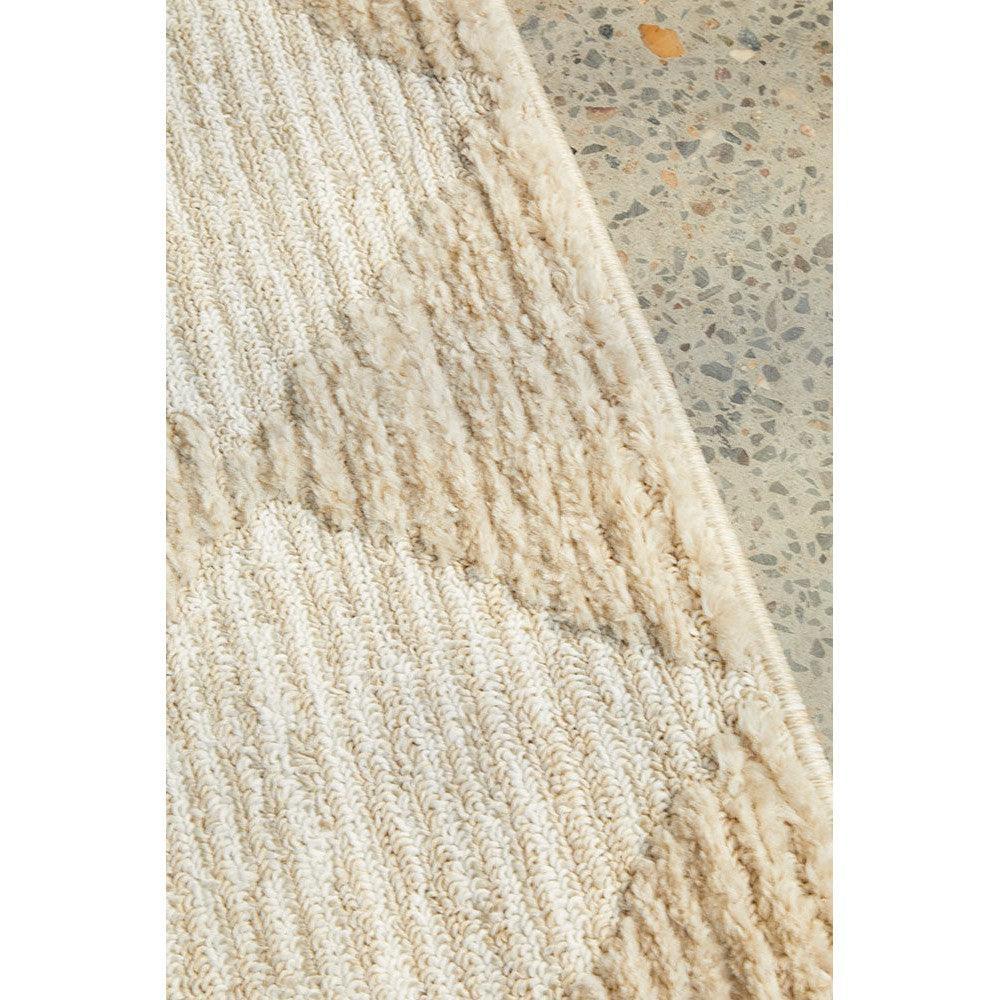 Marigold Aylin Diamond Beige Rug featuring diamond pattern in beige, cream and taupe on terrazzo-grey floor, hand-tufted wool