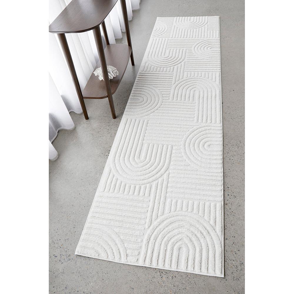 Marigold Dior White Runner Rug featuring geometric arc and line pattern in ivory, cream and light grey on concrete, power-loomed polypropylene