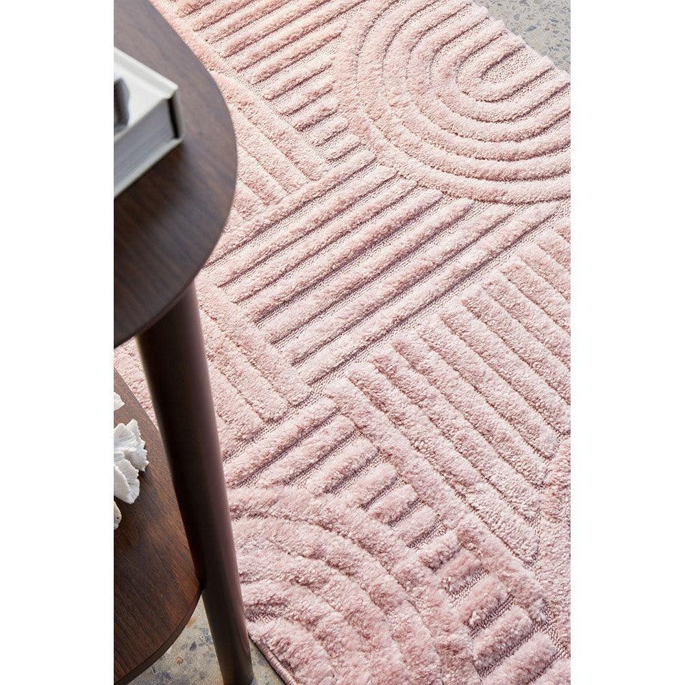 Marigold Jooji Curve Abstract Rug featuring curved line pattern in blush pink, dusty rose and ivory on pink background, machine-made polyester