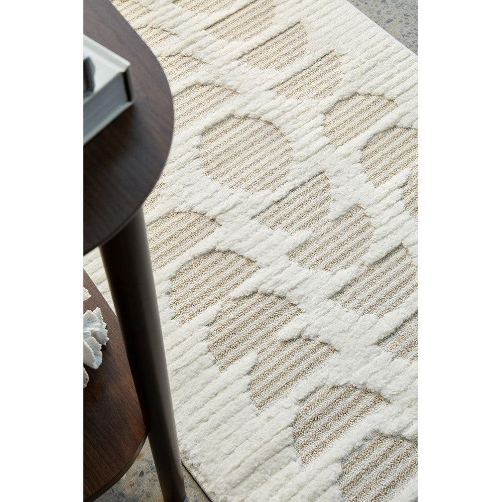 Marigold Lou Abstract Moon Beige Rug featuring an abstract pattern in ivory, taupe and beige on cream background, machine-made polyester blend