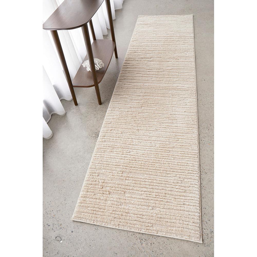 Marigold Suri Natural runner rug with subtle beige-cream-taupe stripes on a light background, machine-made rug