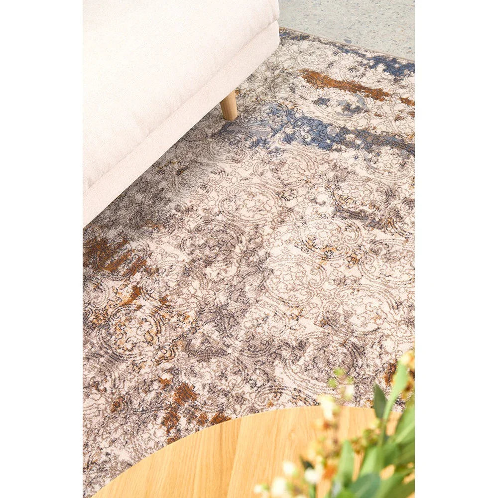 Melody Gayle Multi Rug featuring distressed floral pattern in cream, blue, rust on light beige background, machine-woven polyester