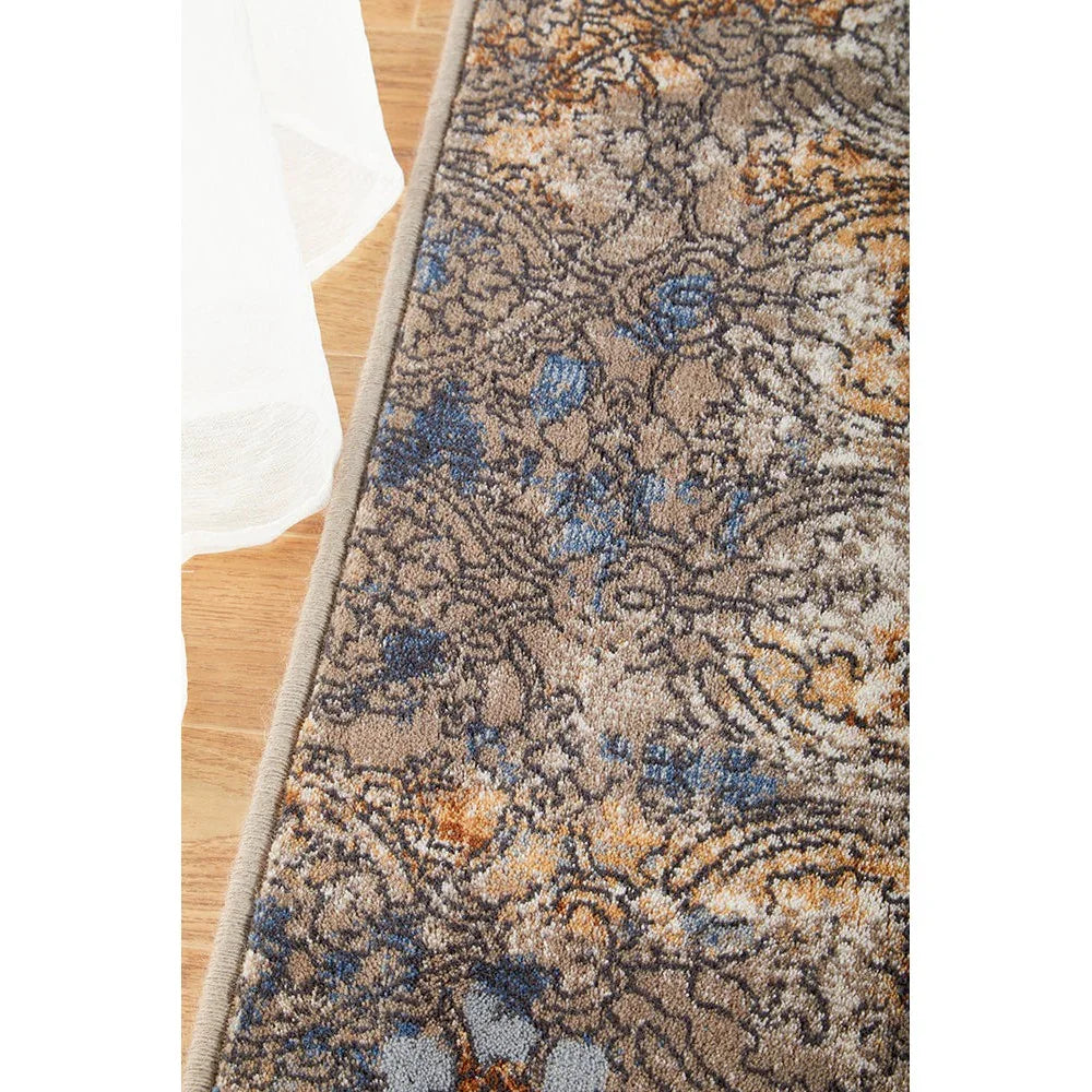 Melody Gayle Multi Rug featuring ornate floral pattern in beige, taupe, blue and ochre on light beige background, machine-made polypropylene